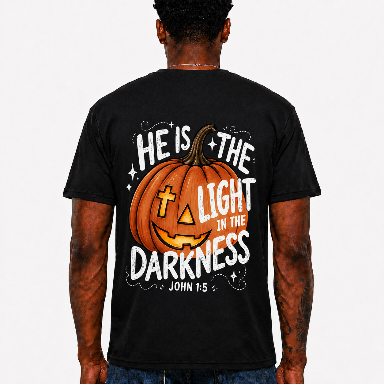He Is The Light In The Darkness Shirt John 1:5 Christian Halloween Pumpkin Graphic Tee for Men