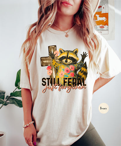 Funny Still Feral Just Forgiven Comfort Colors® Shirt | Christian Raccoon TShirt | Vintage Funny Faith Shirt | Religious Apparel Shirt Tee