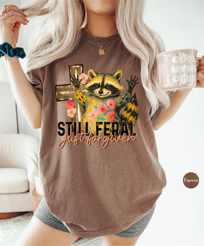Funny Still Feral Just Forgiven Comfort Colors® Shirt | Christian Raccoon TShirt | Vintage Funny Faith Shirt | Religious Apparel Shirt Tee