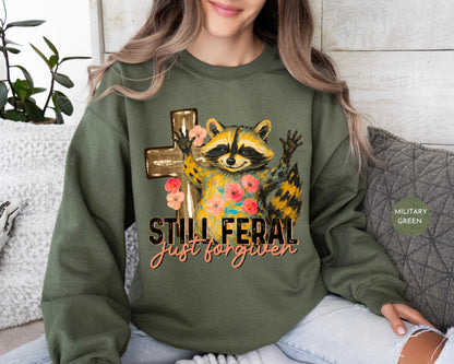 Funny Still Feral Just Forgiven Sweatshirt | Christian Raccoon TShirt | Vintage Funny Faith Shirt | Religious Apparel Shirt Tee Sweatshirt