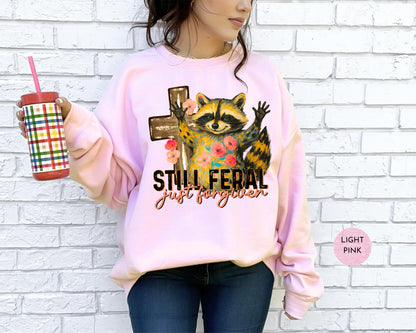 Funny Still Feral Just Forgiven Sweatshirt | Christian Raccoon TShirt | Vintage Funny Faith Shirt | Religious Apparel Shirt Tee Sweatshirt