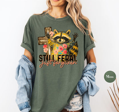 Funny Still Feral Just Forgiven Comfort Colors® Shirt | Christian Raccoon TShirt | Vintage Funny Faith Shirt | Religious Apparel Shirt Tee