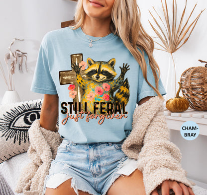 Funny Still Feral Just Forgiven Comfort Colors® Shirt | Christian Raccoon TShirt | Vintage Funny Faith Shirt | Religious Apparel Shirt Tee